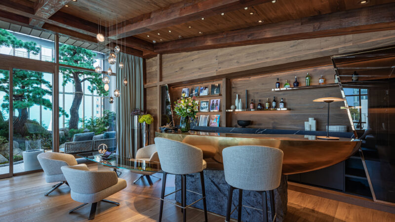 Bar and seating beside windows in official AP House Seoul photography