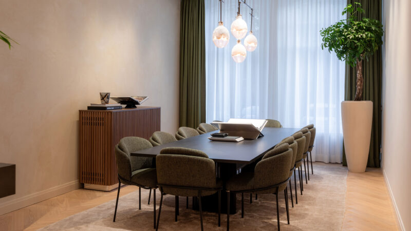 Seating around a table in the official AP House Amsterdam gallery