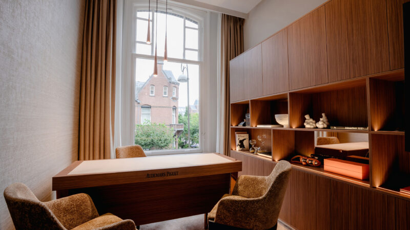 Desk and seating by a window in official AP House Amsterdam photography