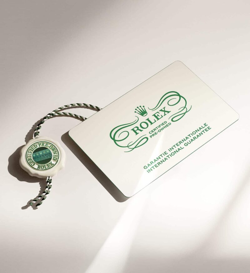Rolex Certified Pre-Owned guarantee card and seal on a light surface