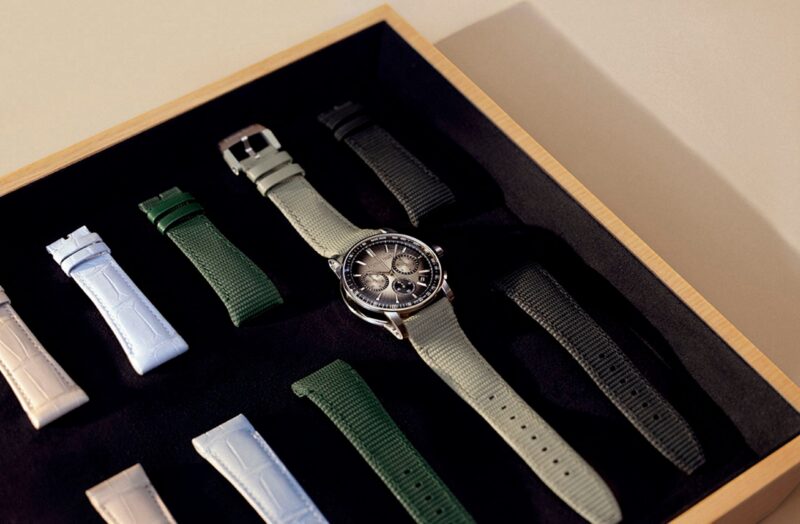 Audemars Piguet watch and differently coloured straps arranged in a presentation box