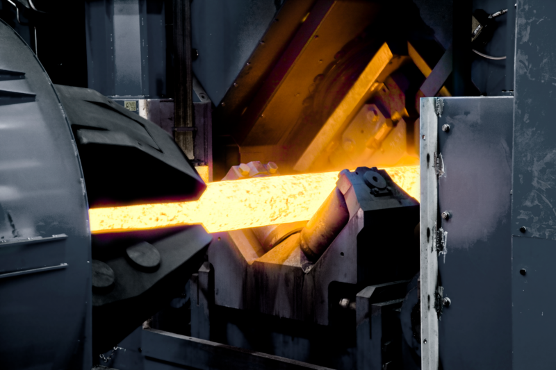 Glowing hot metal in industrial equipment in official Chopard production photography
