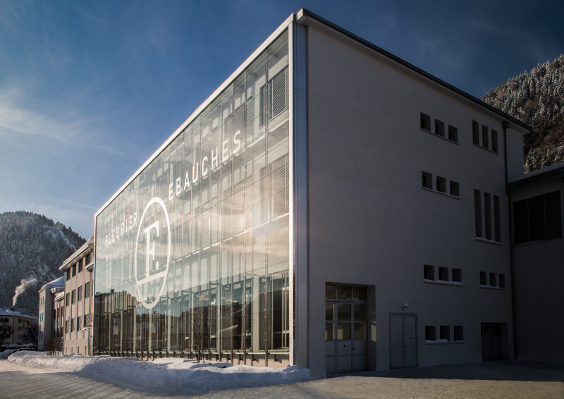 Exterior of the Fleurier Ebauches manufacture with glazed facade in Chopard photography