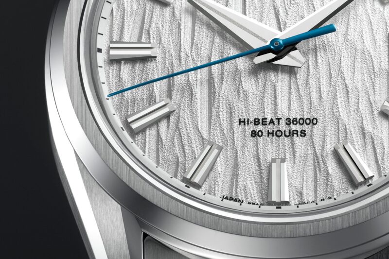 Textured silver dial and blue seconds hand of the Grand Seiko SLGH005