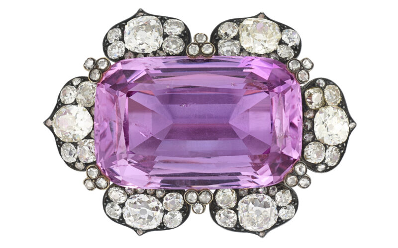 Pink rectangular gemstone in an antique-style jewel setting surrounded by white stones in Christie’s imagery