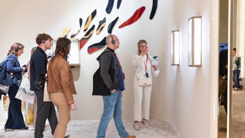 Small group listening to a guide in an exhibition space in official Watches and Wonders photography