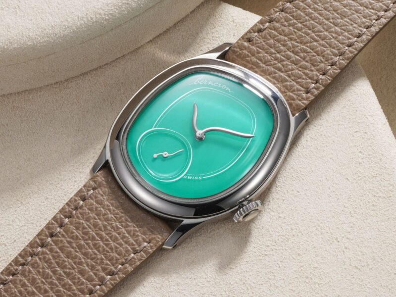 Green-dial watch with a small seconds display and beige strap in Phillips photography