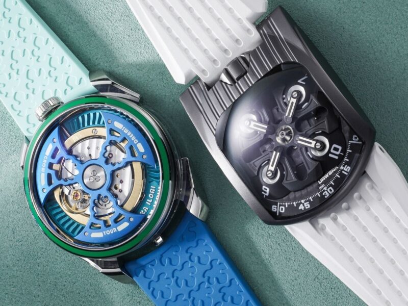 Two contemporary watches with blue and dark dials and patterned straps in Phillips photography