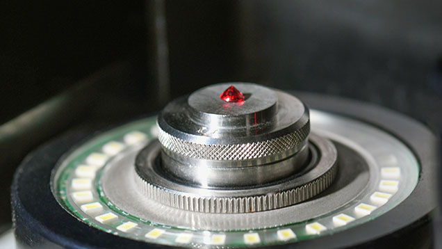 Ruby positioned in a gemological measurement instrument at GIA