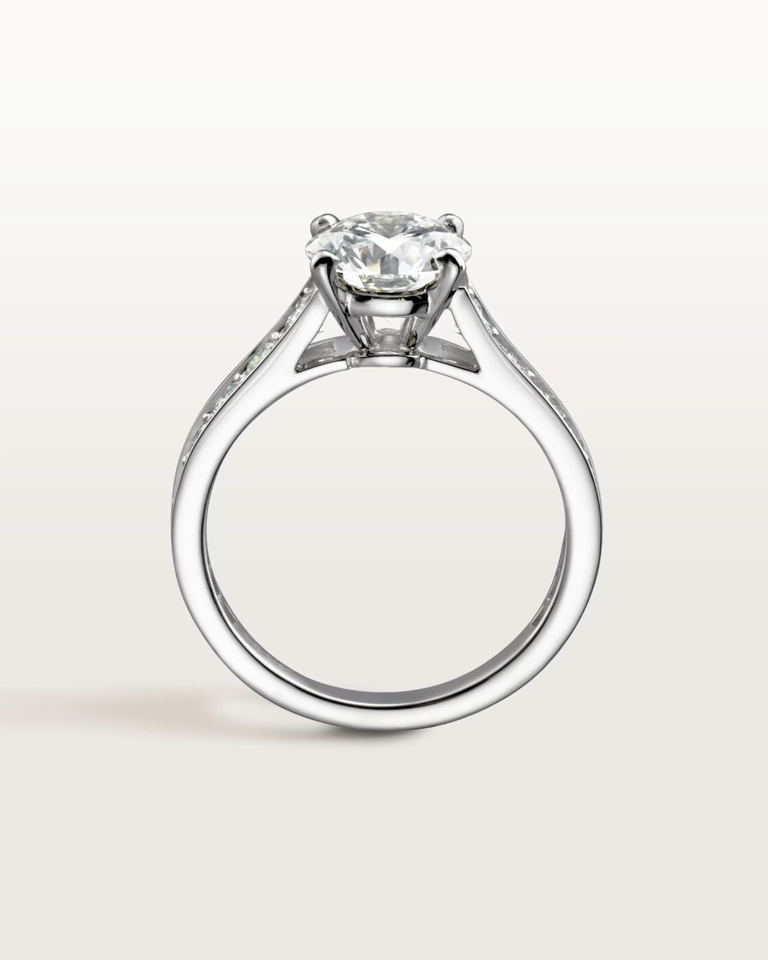 Studio shot of the classic Cartier Trinity ring featuring three interlocking bands of white, yellow, and rose gold