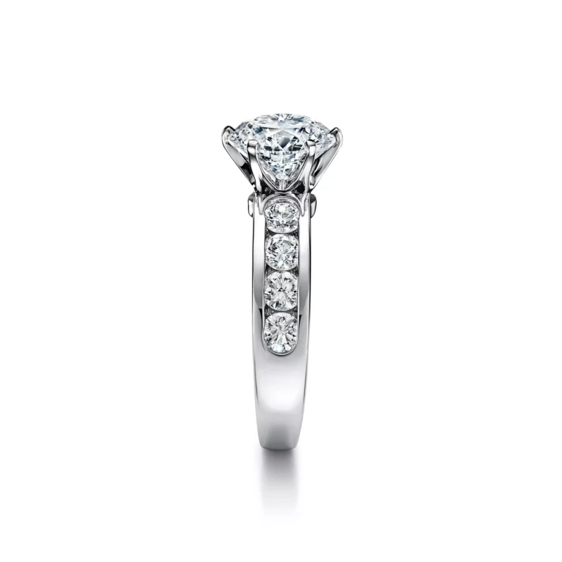 Angled view of the rose gold Tiffany Soleste ring featuring a round center diamond bordered by a double halo of pave diamonds
