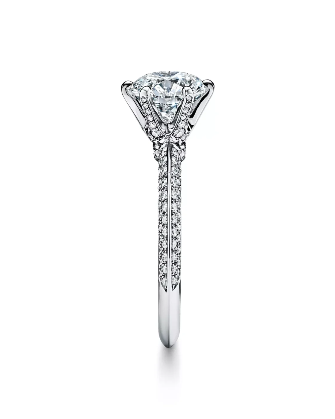 Angled view of the rose gold Tiffany Soleste pear-shaped diamond engagement ring with a single pave halo and diamond band