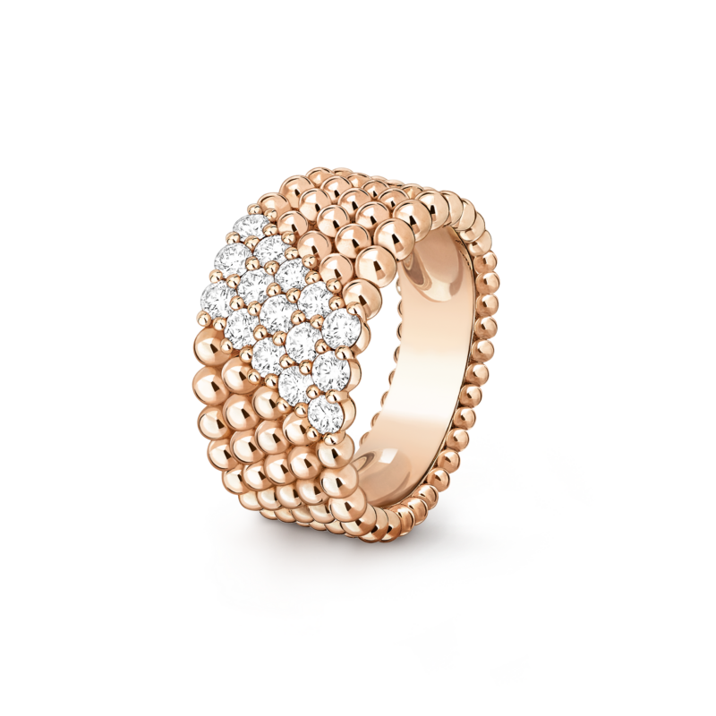 Van Cleef & Arpels Perlee multi-row ring in rose gold with round white diamonds paved in the middle rows, isolated on dark background