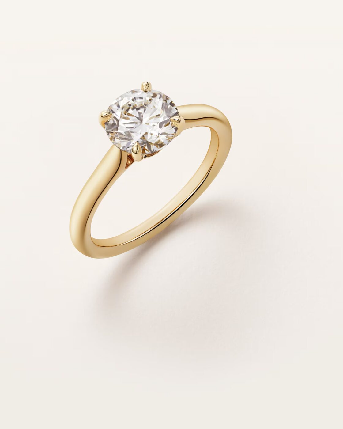 Direct side-profile studio view of the Cartier Solitaire 1895 solitaire ring displaying the high four-prong setting