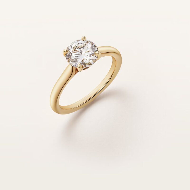 Direct side-profile studio view of the Cartier Solitaire 1895 solitaire ring displaying the high four-prong setting