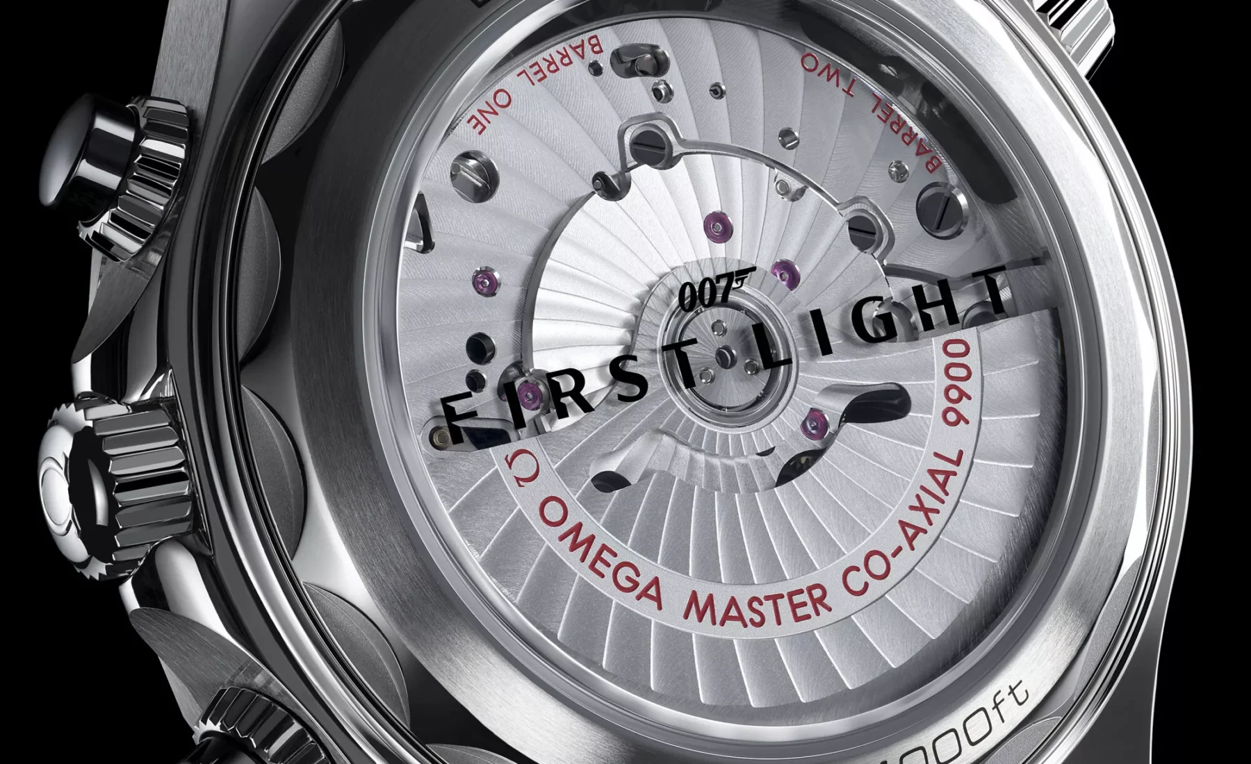 Vertical caseback view of the Omega Seamaster Diver 300M Chronograph 007 First Light showing the Co-Axial movement and FIRST LIGHT text