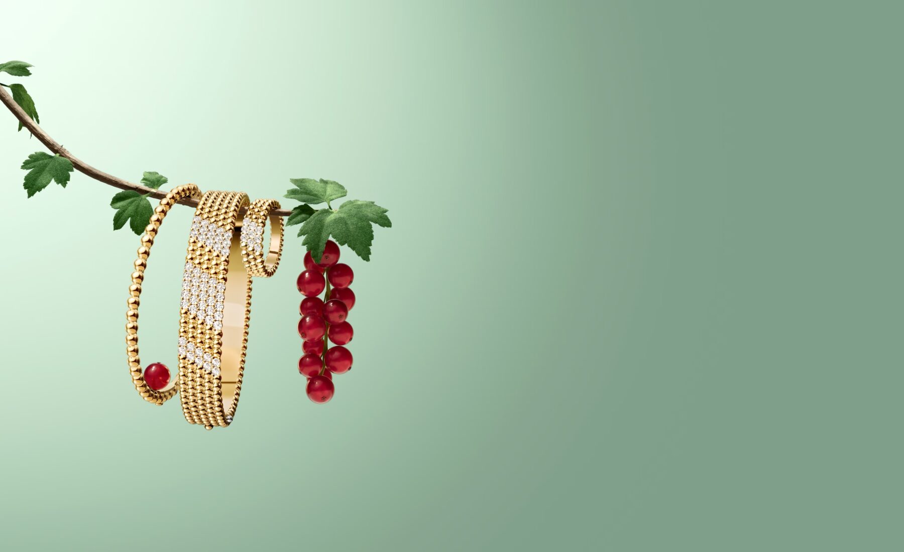 Two Van Cleef & Arpels Perlee yellow gold beaded bracelets hanging on a green tree branch with red currants