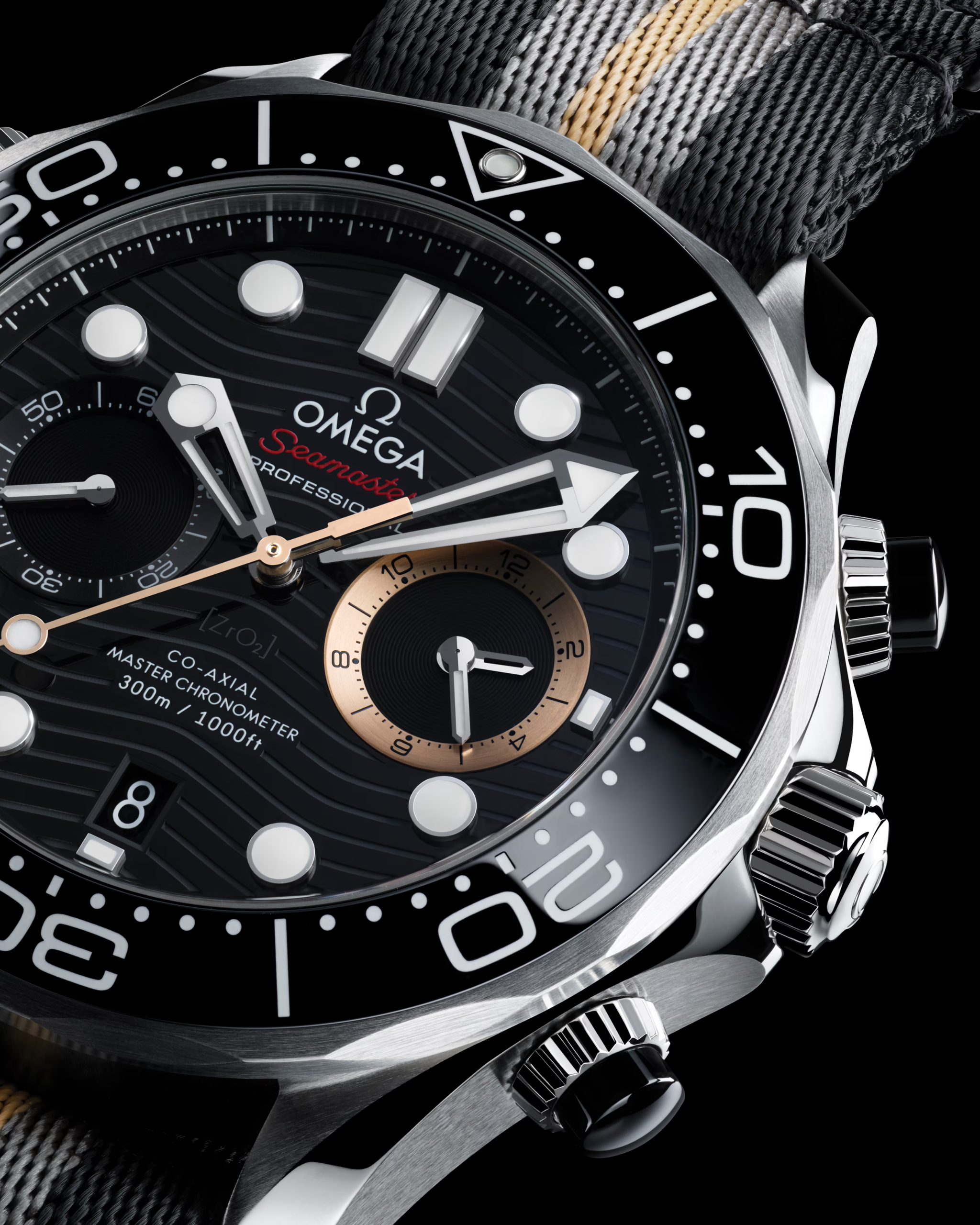 Macro close-up view of the Omega Seamaster Diver 300M Chronograph 007 First Light dial lettering and hour markers