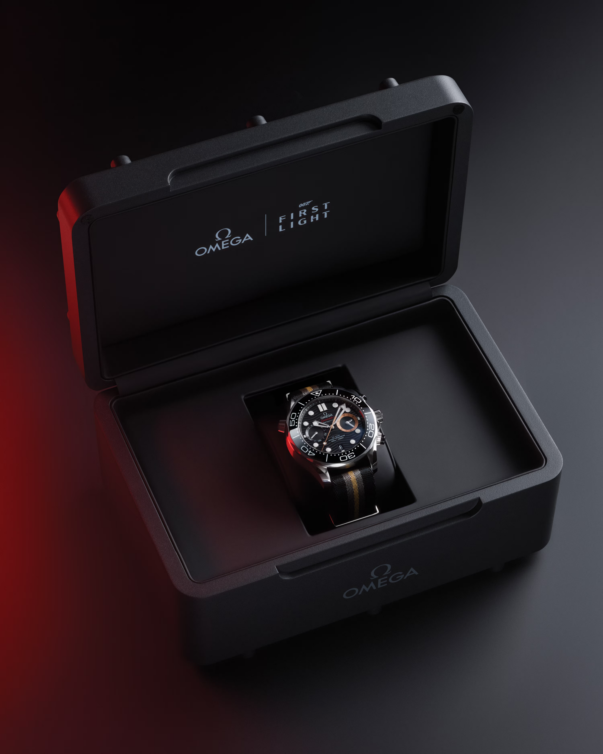 The Omega Seamaster Diver 300M Chronograph 007 First Light sitting in its custom open presentation box with red dramatic glow