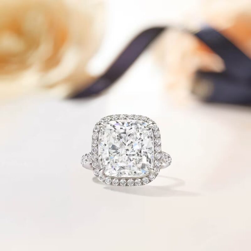 Detailed studio view of the Harry Winston The One cushion-cut diamond solitaire ring featuring a micropave halo and band
