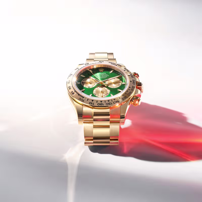Rolex Cosmograph Daytona yellow gold green dial light study