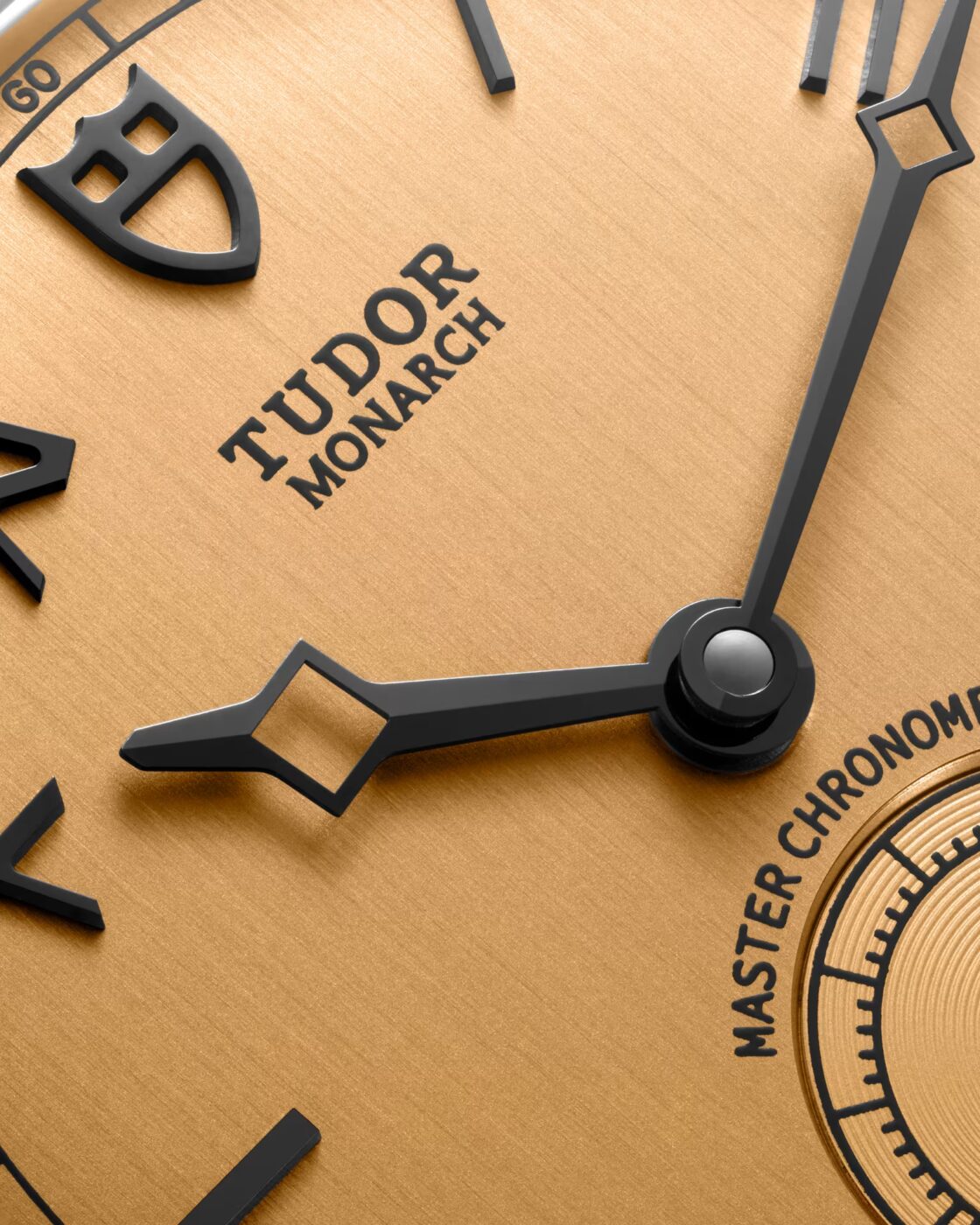 Macro close-up of the champagne textured California dial of the Tudor Monarch