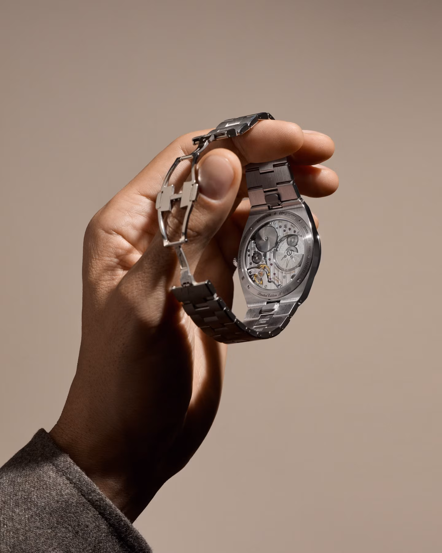 Vacheron Constantin Overseas caseback and movement held in hand
