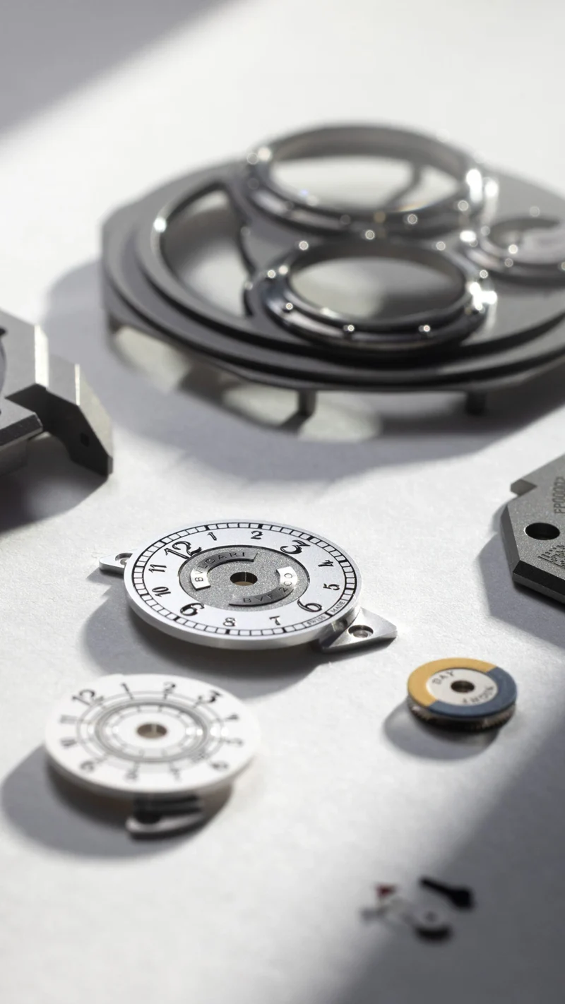 Separate dial and case components before assembly.