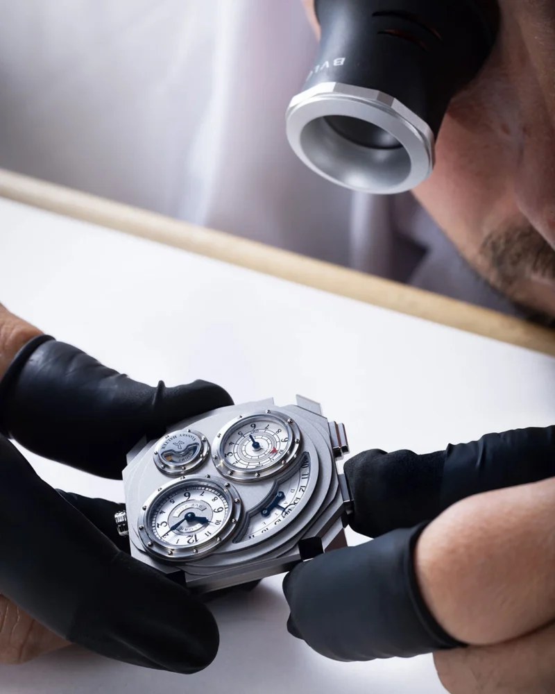 The completed titanium Dual Time examined at the bench.