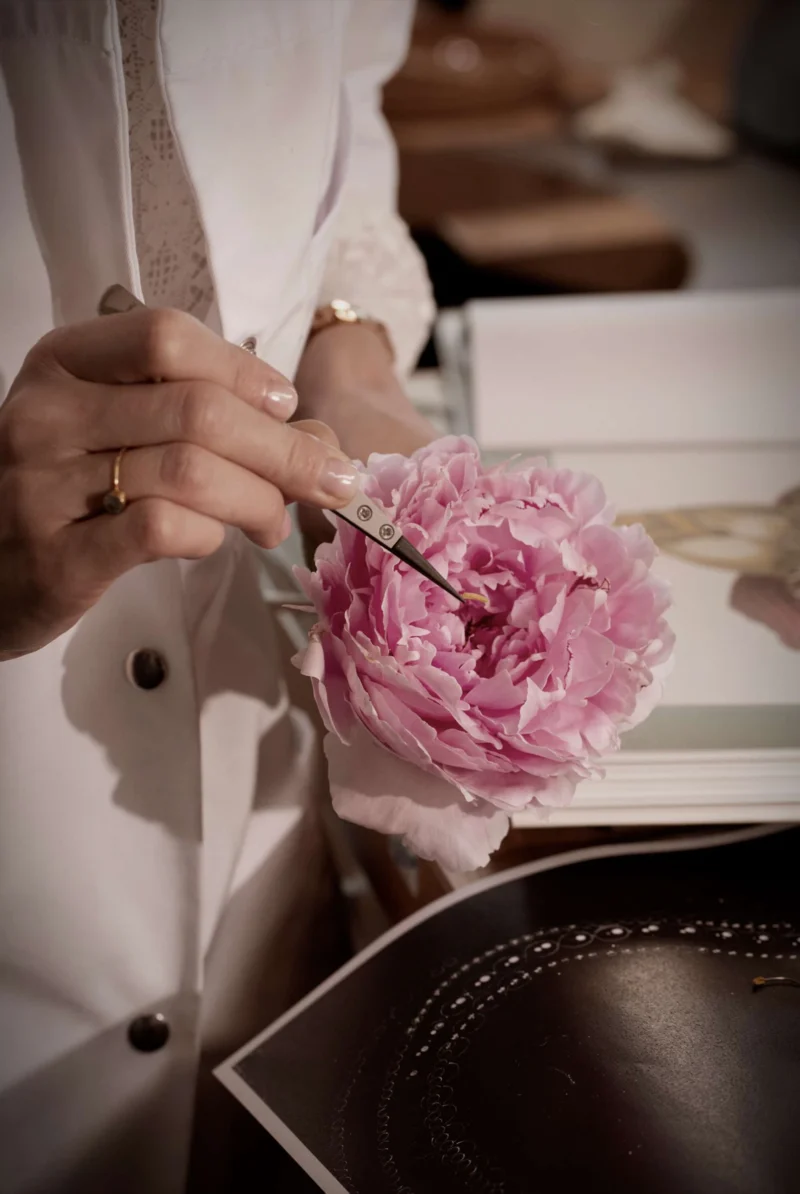 Chopard artisan studying a flower form