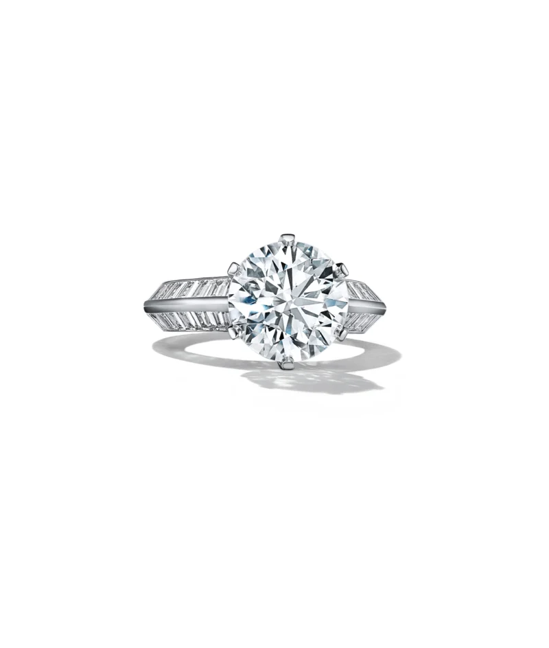 Tiffany platinum engagement ring with a round brilliant centre diamond and baguette side stones