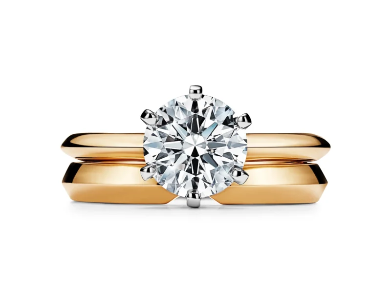 The Tiffany Setting in yellow gold with a matching wedding band