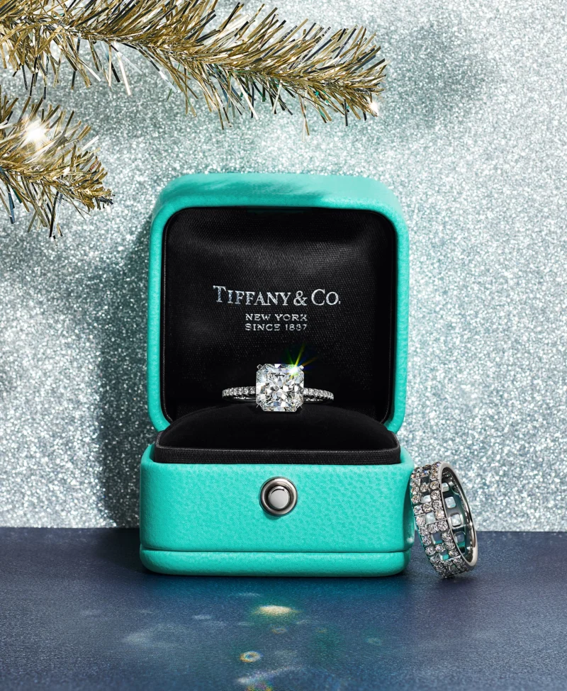 Tiffany True engagement ring and diamond band presented in an open Blue Box