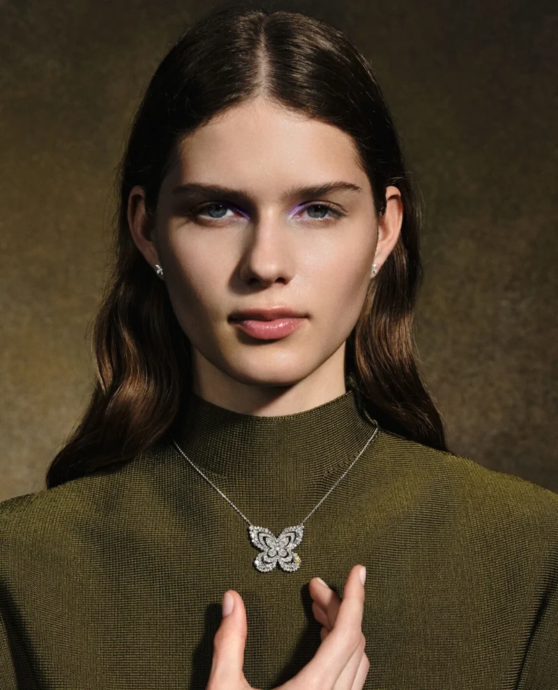 Model wearing the Graff Marina butterfly as a pendant