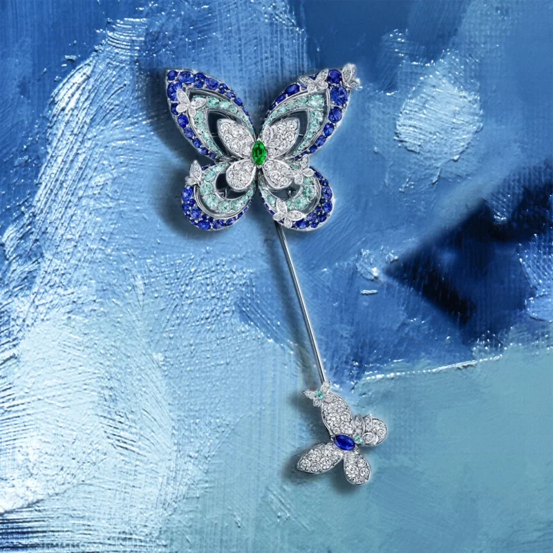 Graff butterfly brooch on a blue painterly field