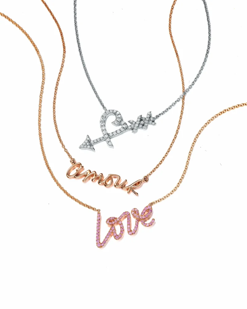 Three Paloma Picasso Graffiti pendants spelling kiss, amour and love