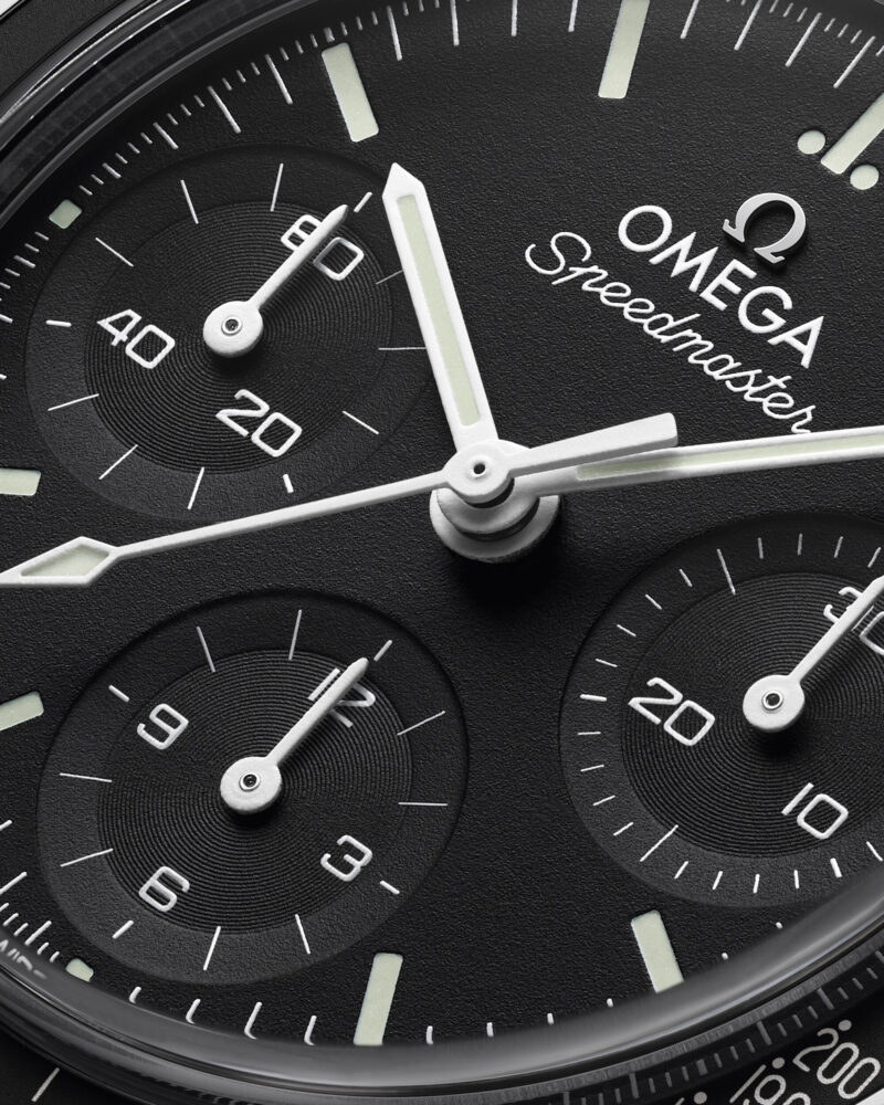 Black dial detail of the Omega Speedmaster 38