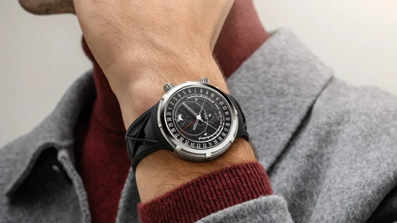 Patek Philippe Ref. 6105G worn on the wrist in conversation