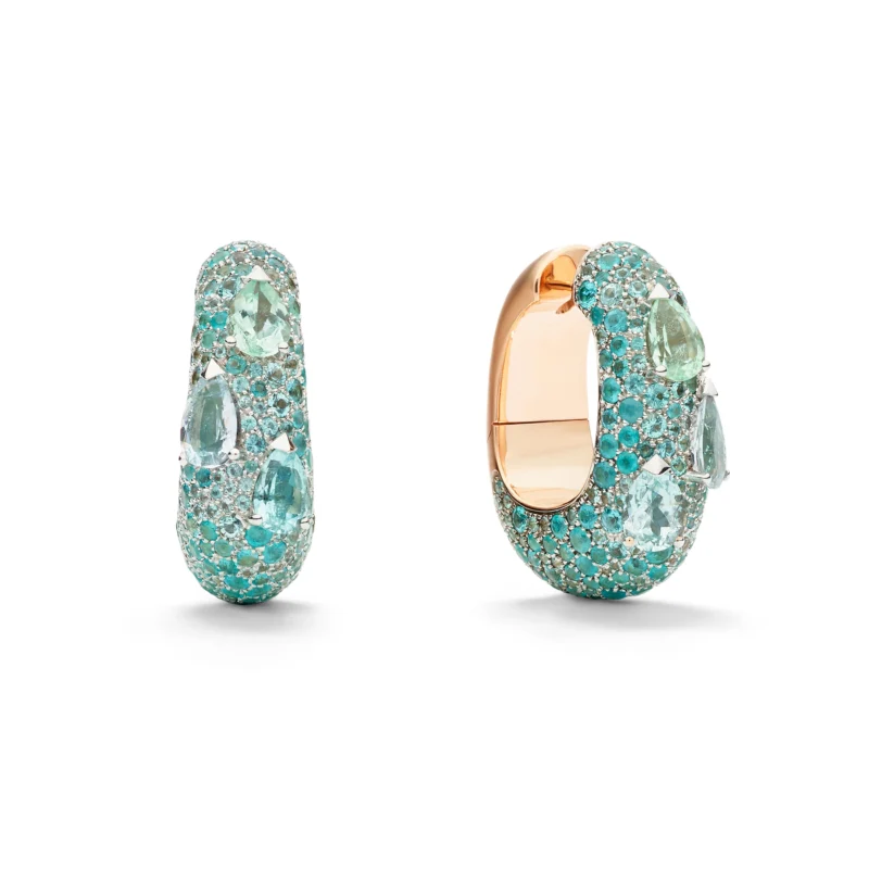 Turquoise-coloured stones arranged across rounded rose-gold earrings.