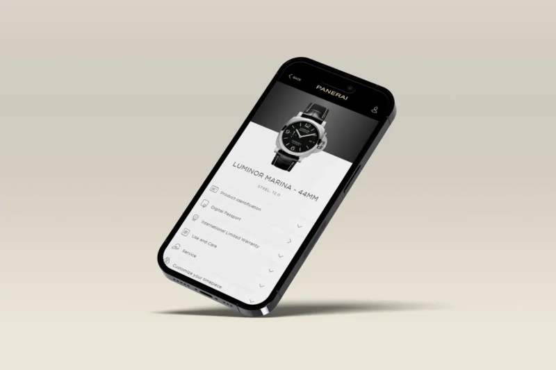 Panerai watch beside a smartphone displaying its digital product passport