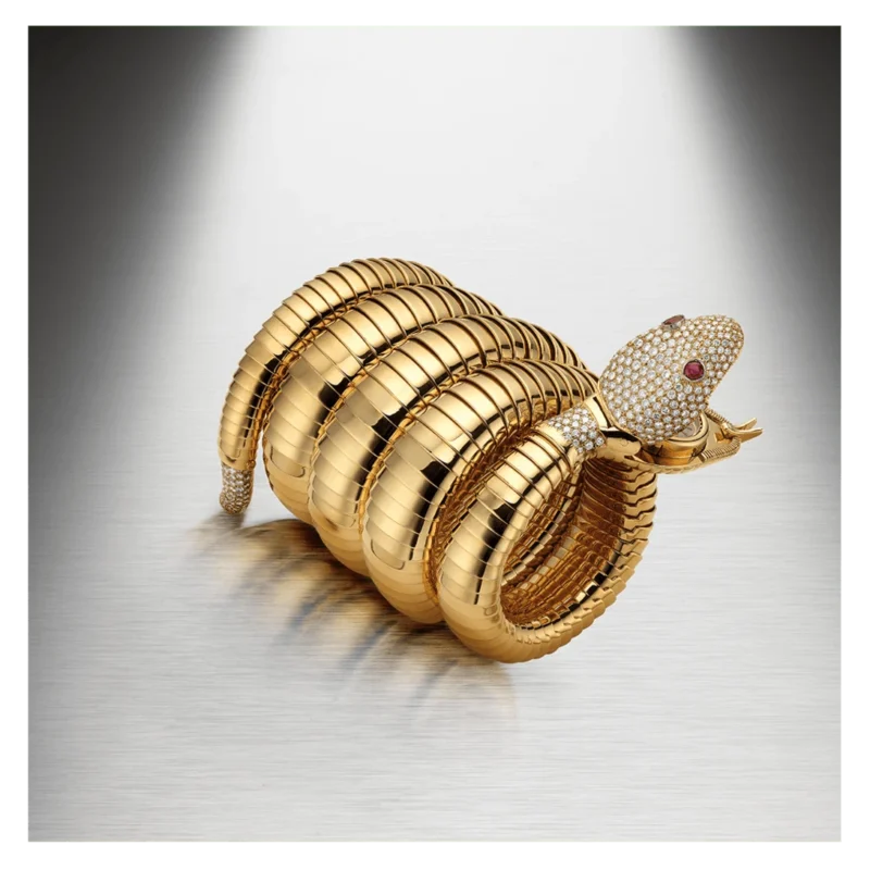 Coiled gold Bulgari Serpenti with an open jewelled head
