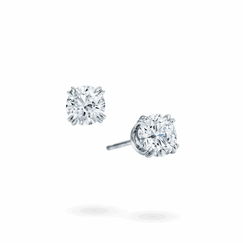 Harry Winston round brilliant diamond earstuds with one stud shown in profile.