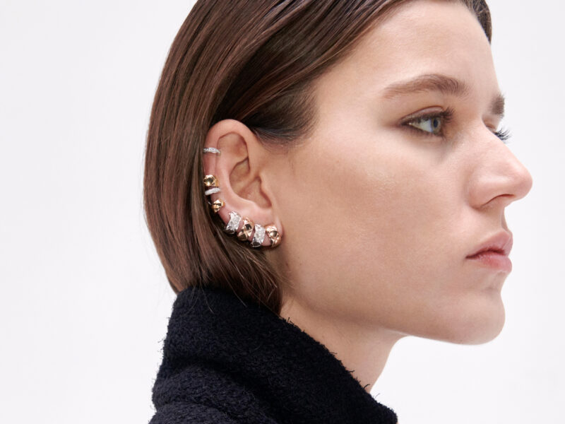 CHANEL COCO CRUSH earrings worn together along the ear.