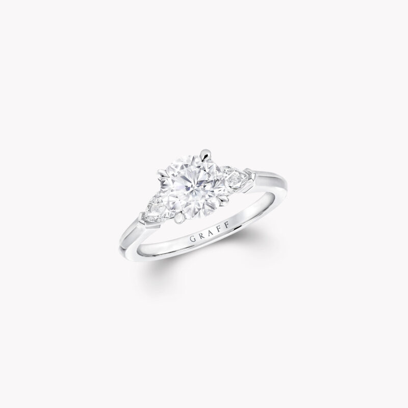 Graff Promise RP01 round diamond ring with pear-shape side stones.