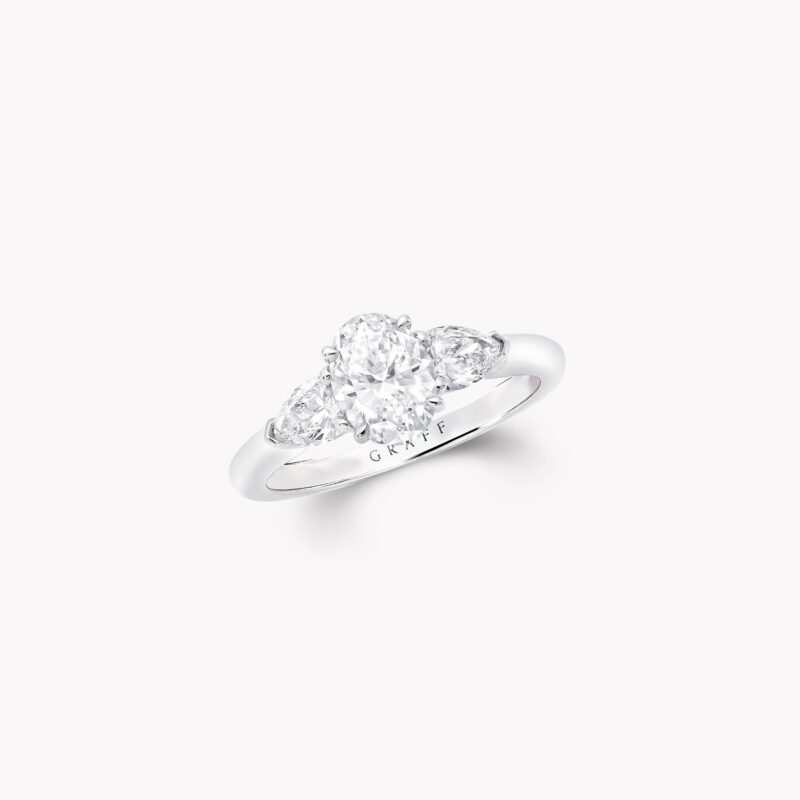 Graff Promise OP01 oval diamond ring with pear-shape side stones.