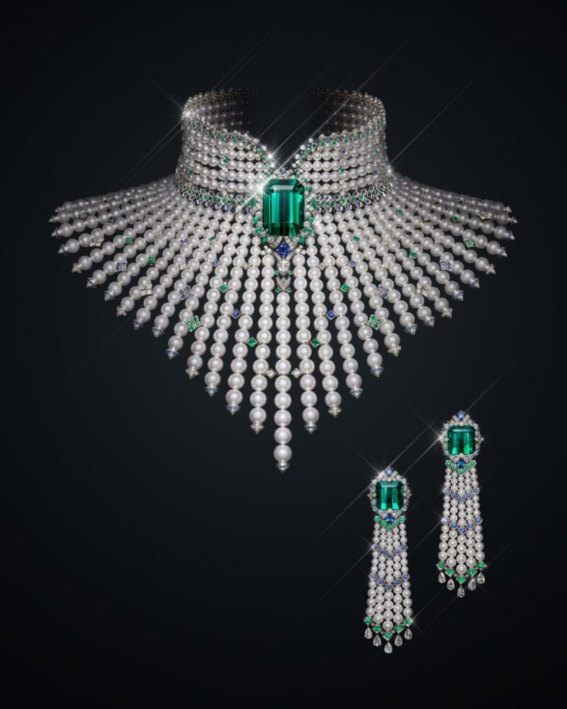 Mikimoto L’éclat Solaire necklace and earrings with a green rectangular centre, pearl collar and fan of descending pearl strands.