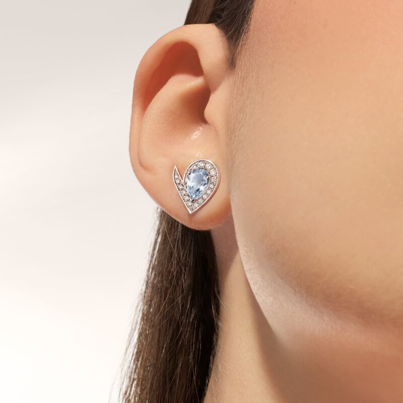 Chaumet Joséphine aquamarine earring 085190 worn against the ear and jaw.