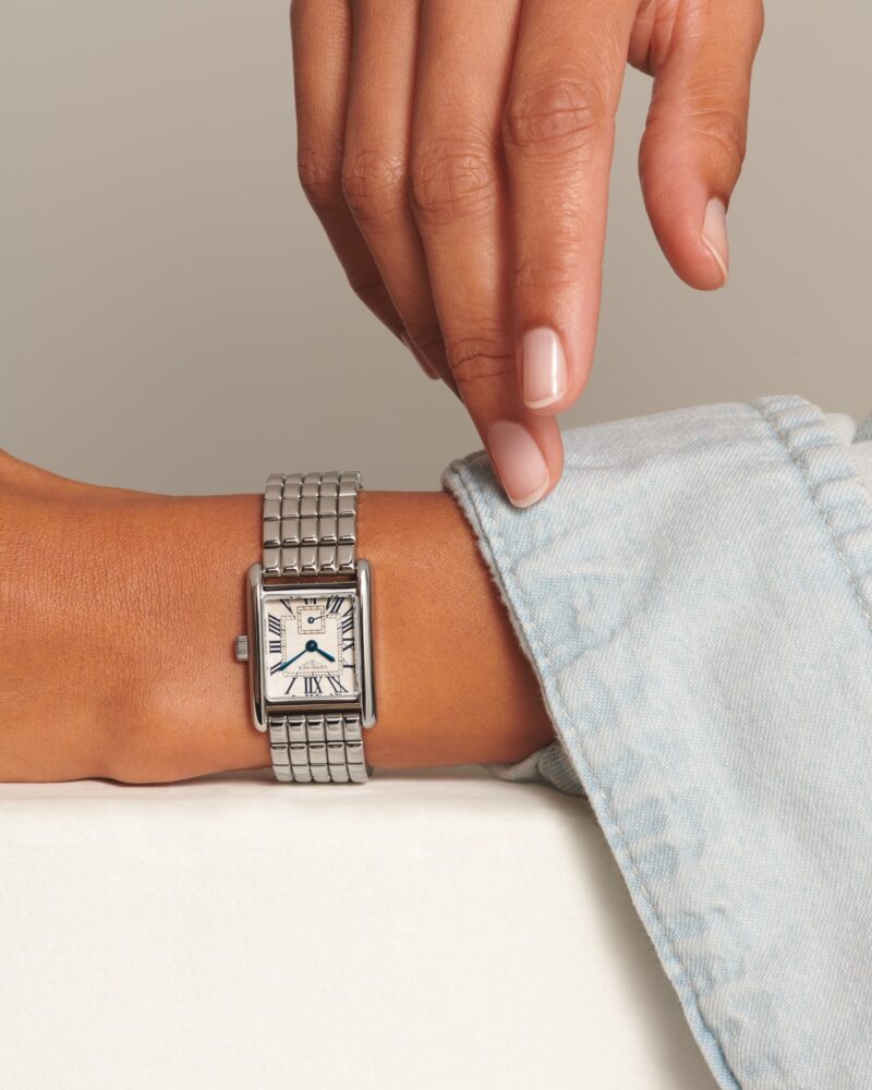 Longines Mini DolceVita L5.200.4.71.6 worn beside a pale blue casual sleeve.
