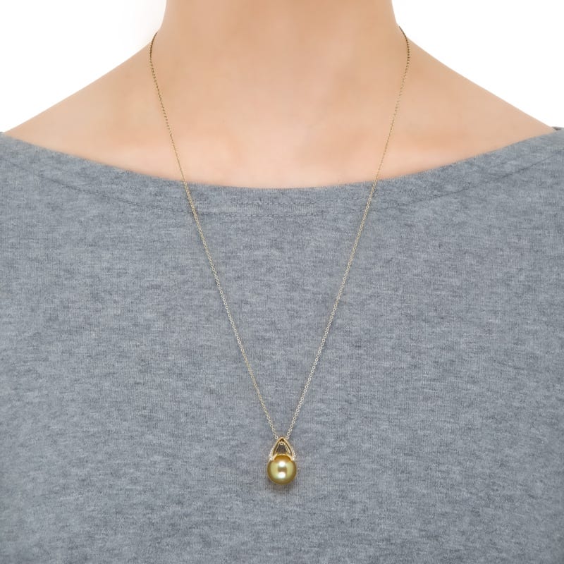 Mikimoto M Collection golden South Sea cultured pearl pendant worn at the neck.