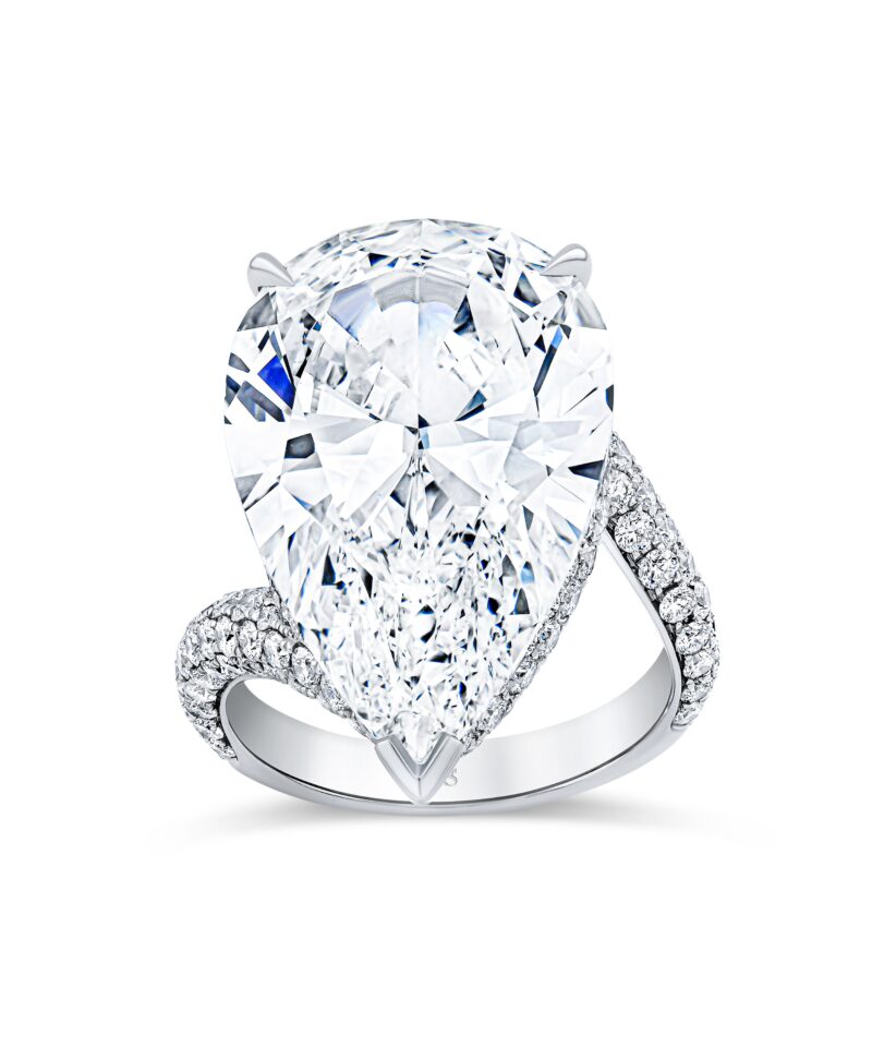 Norman Silverman pear diamond solitaire ring with a pavé diamond band.